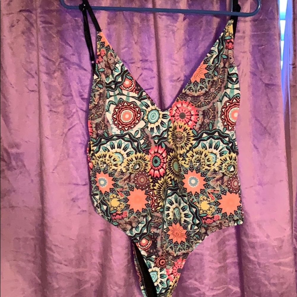 High cut, low back, one piece swim suit.